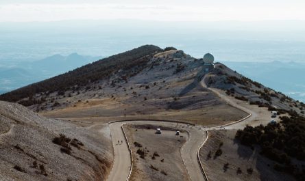 aerial view of a road in the middle of a mountains