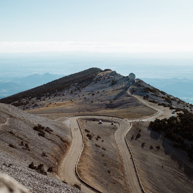 aerial view of a road in the middle of a mountains